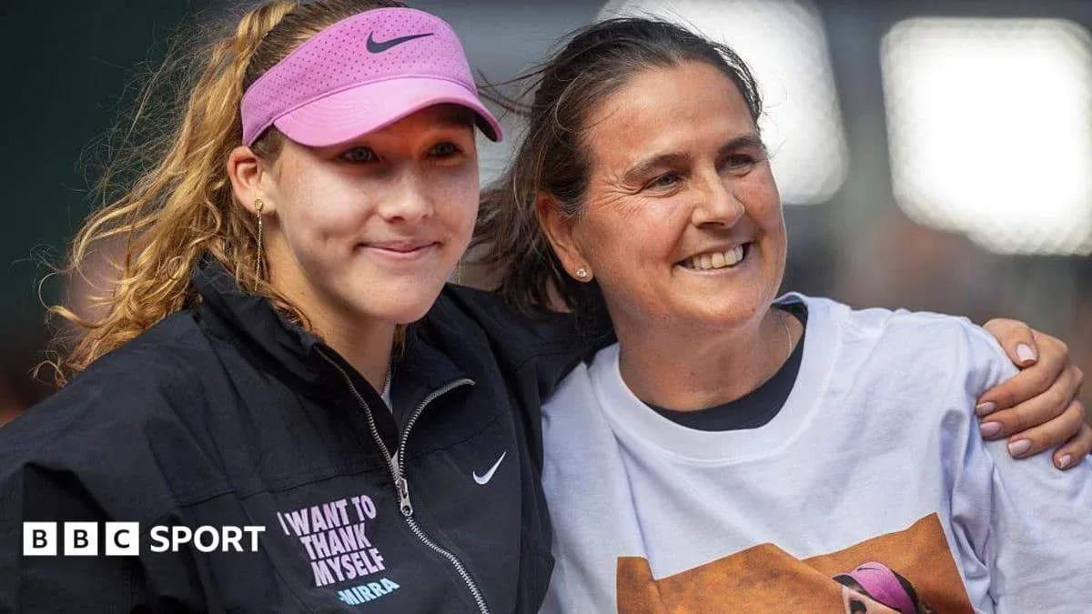 Tennis player and coach posing together after match