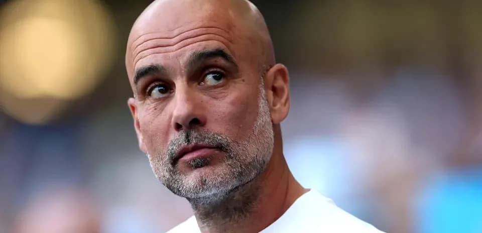 Bald coach observing during a football match