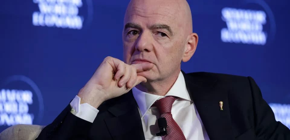 Man in suit during conference with thoughtful expression