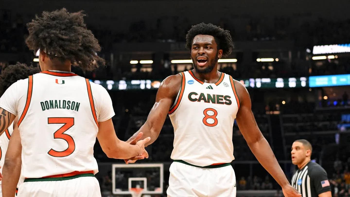 Miami players celebrating during NCAA basketball game