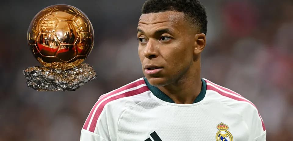 Kylian Mbappé with Ballon d'Or trophy nearby