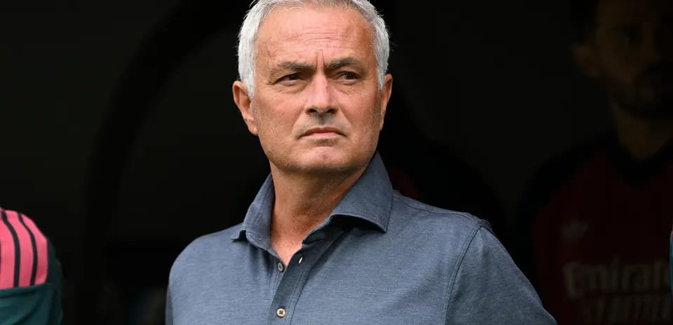 Football manager observing from the sidelines
