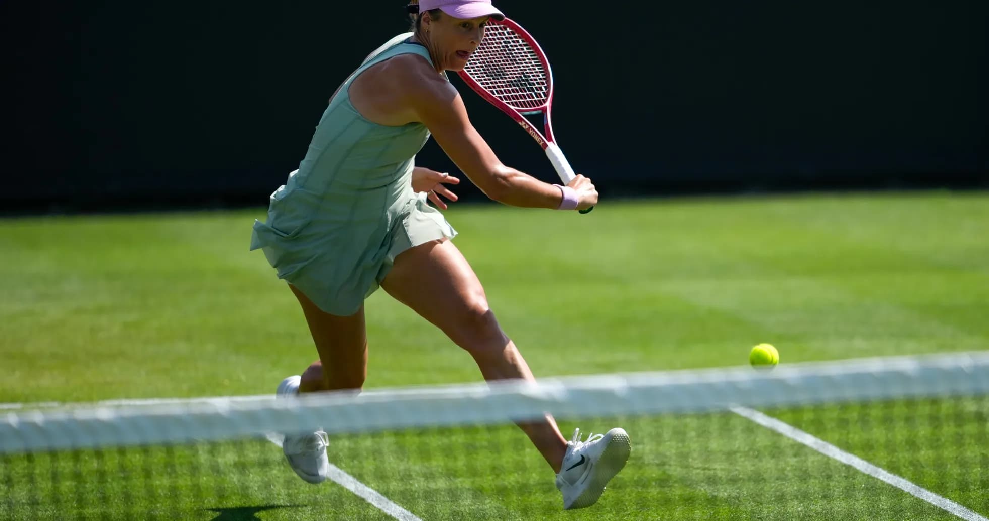 Tennis player hitting a ball during a match