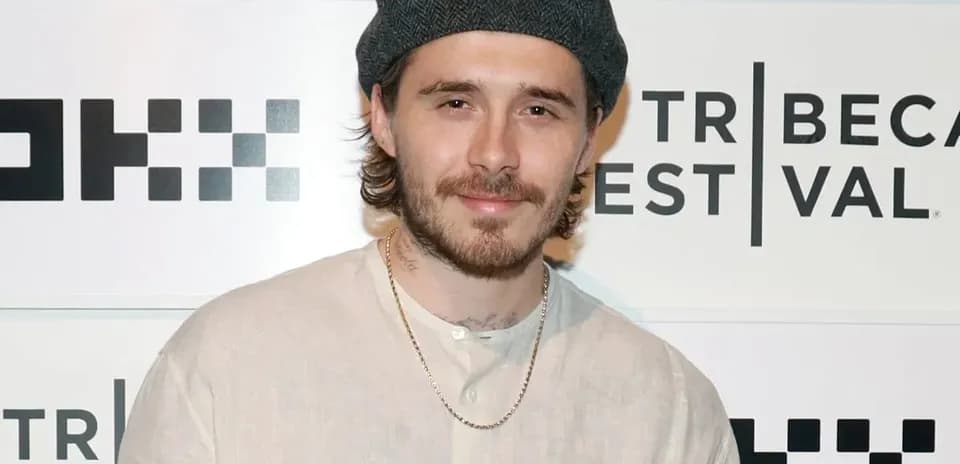 Shirted man posing at Tribeca Film Festival