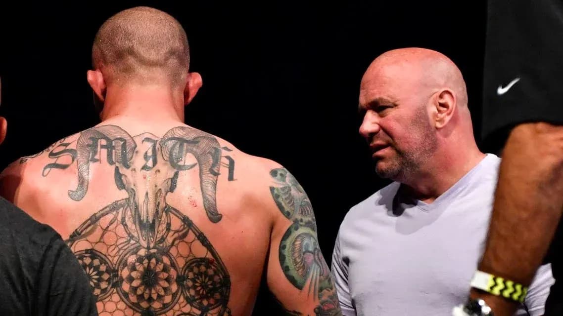 Tattooed fighter talking to UFC president backstage