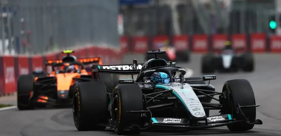 Formula 1 cars racing on city circuit