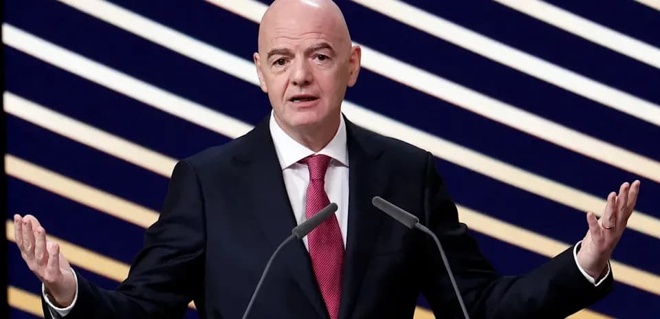 FIFA president speaking at podium during event