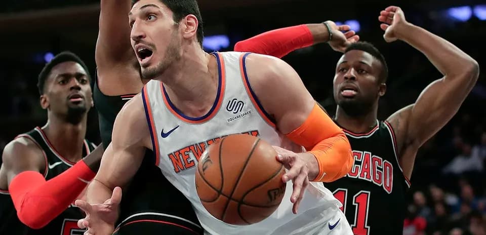 New York Knicks player battling for the ball