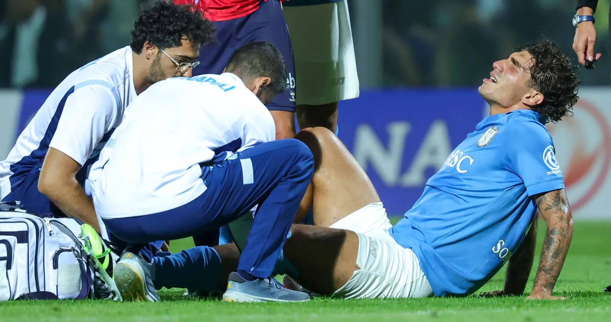 Player receiving medical attention on the field