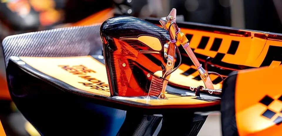 Formula 1 car wing detail with orange accents
