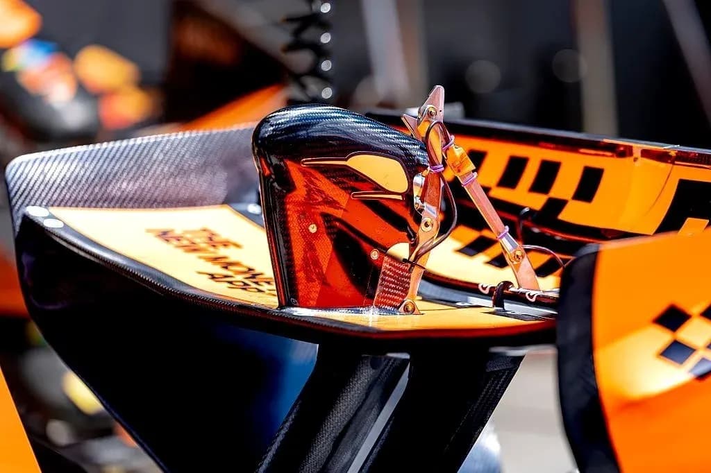 Formula 1 car wing detail with orange accents