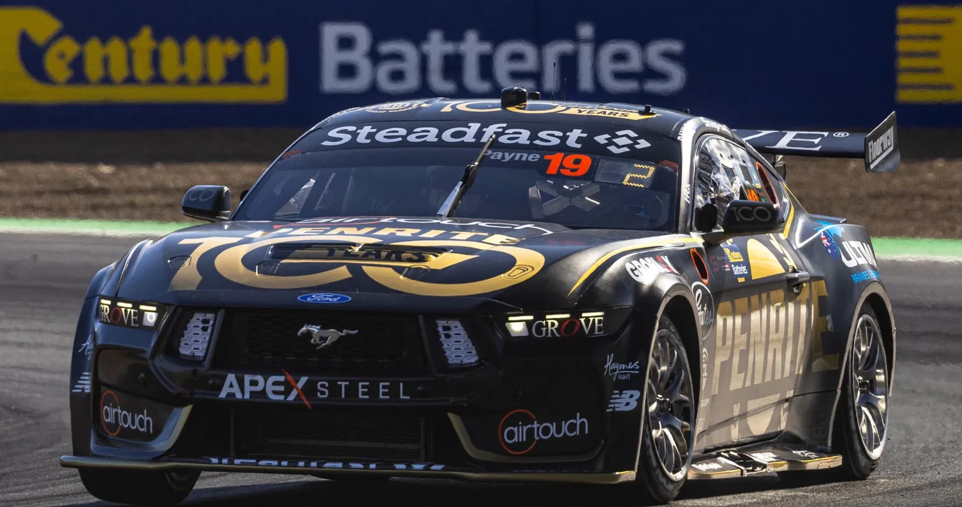 Ford Mustang racing car on track during event
