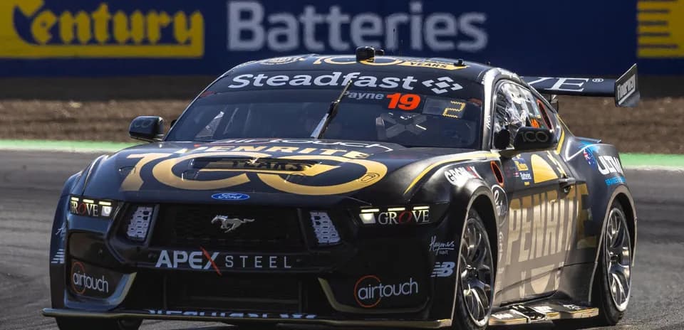 Ford Mustang racing car on track during event