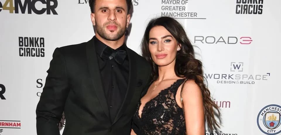 Couple posing together at a formal event