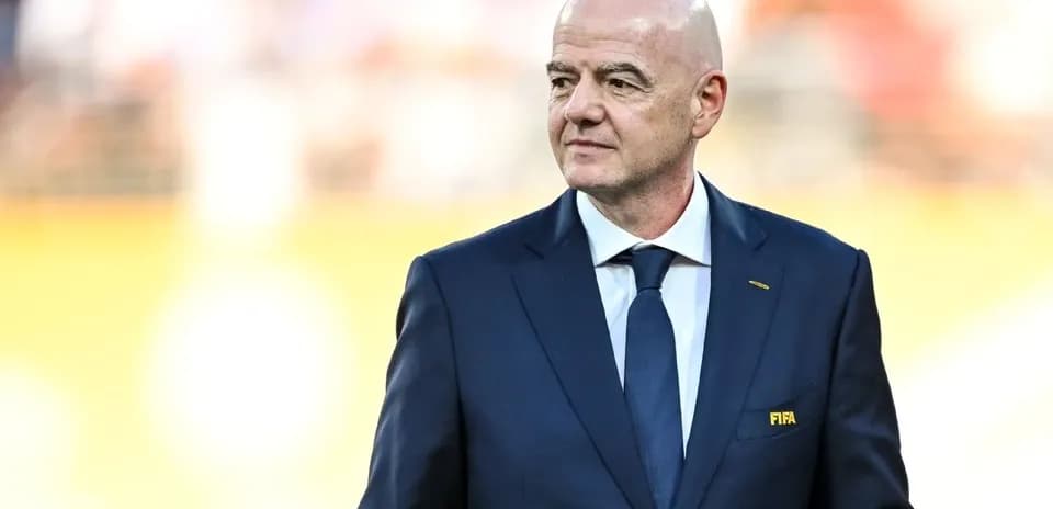 FIFA president walking on the field before match