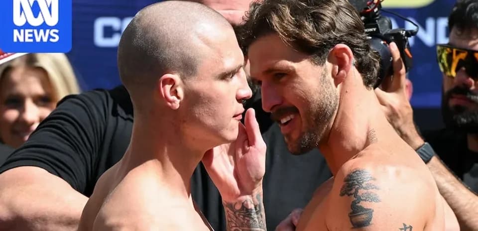Two fighters facing off during weigh-in event