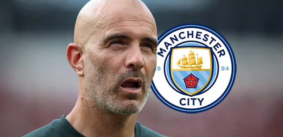 Men's football coach with Manchester City logo
