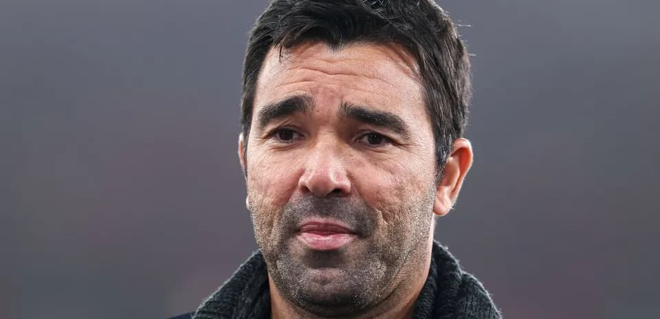Coach speaking during a press conference