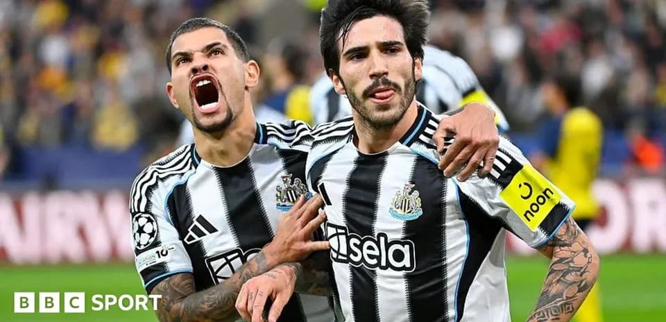 Newcastle players celebrating a goal during match