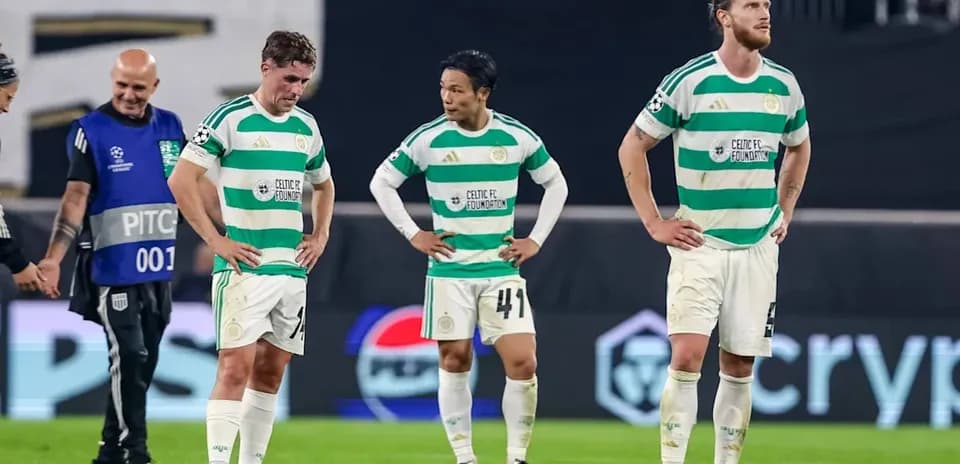 Celtic FC players standing dejected on the pitch