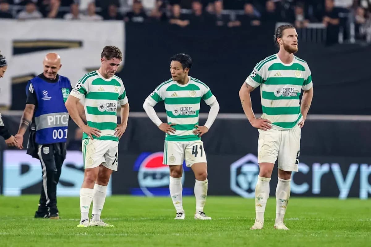 Celtic FC players standing dejected on the pitch