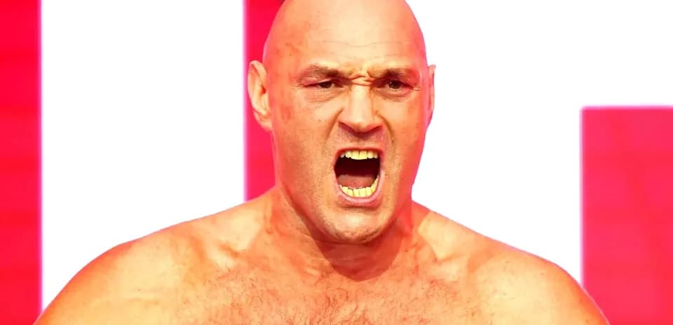 Boxer shouting with intense expression on stage