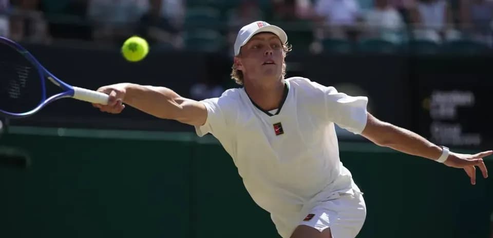 Tennis player hitting a ball during match