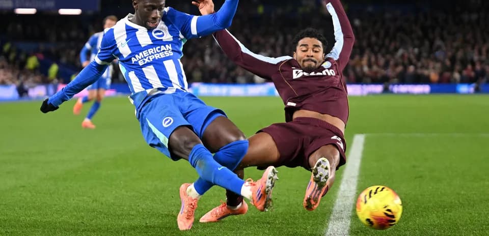 Two players colliding during a football match