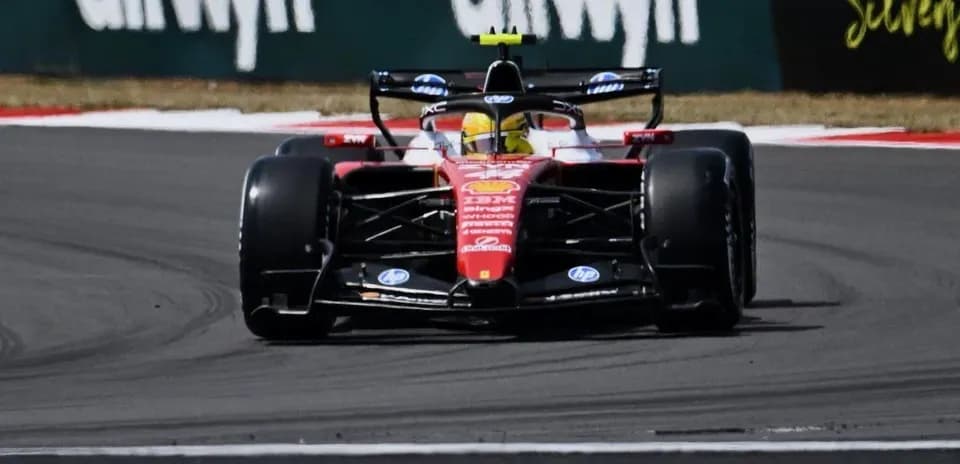 Formula 1 car navigating a sharp turn on track