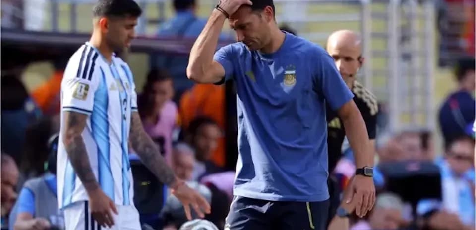 Argentina coach and player on the sidelines during match
