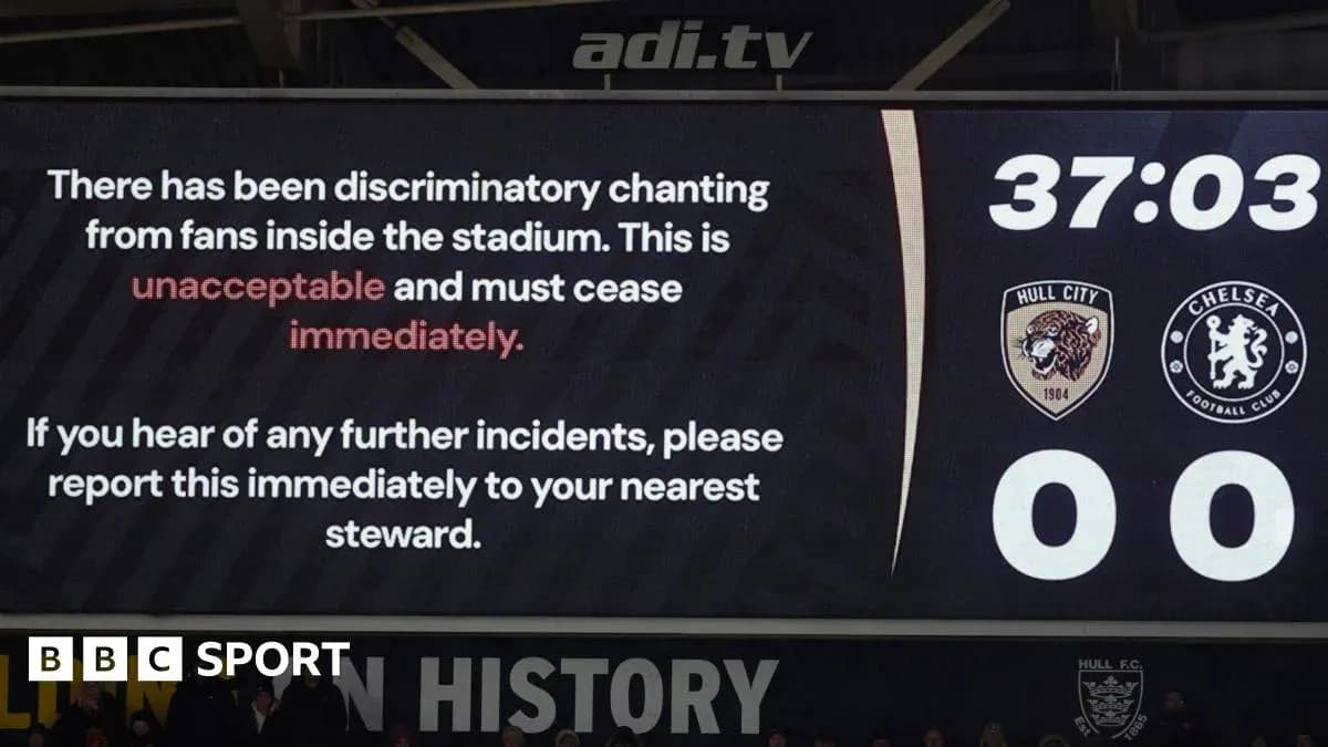 Stadium screen displaying warning about discriminatory chanting