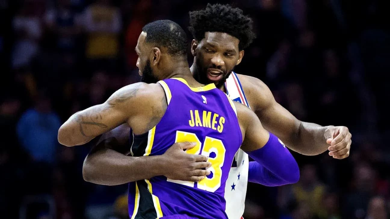 LeBron James and Joel Embiid embracing on court
