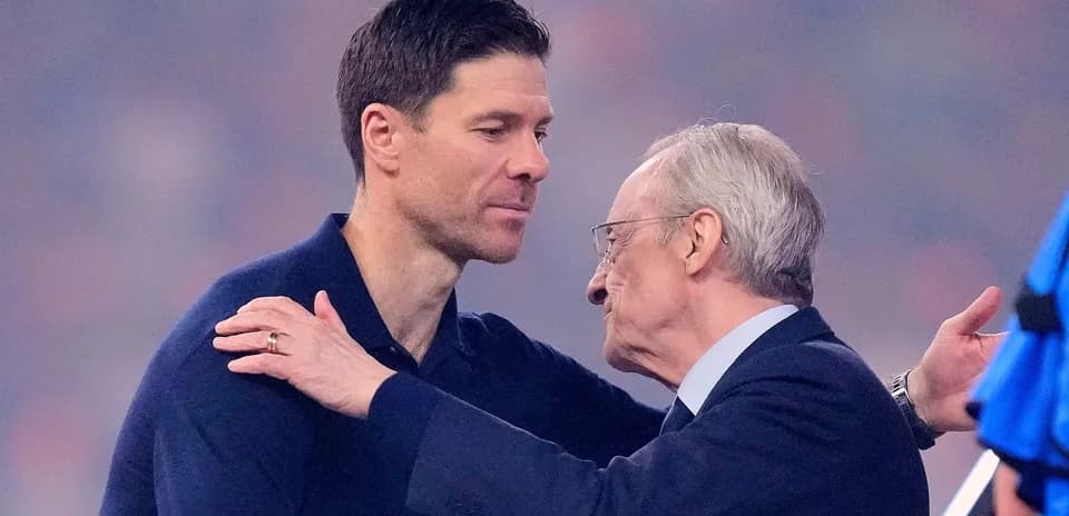 Two men embracing on a football field