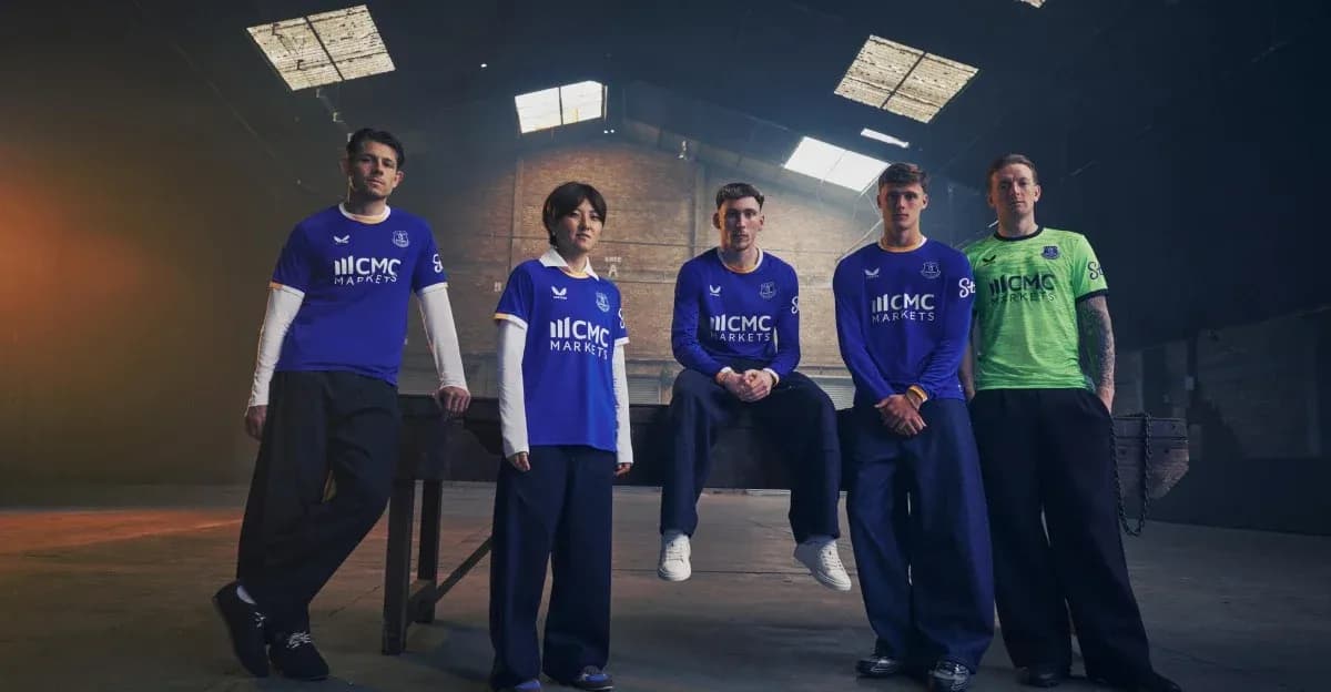 Everton players in new kit posing indoors