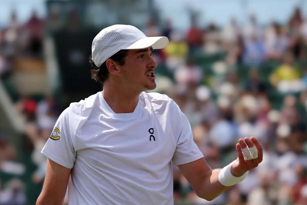 Tennis player gesturing during a match