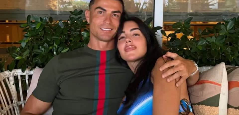 Couple posing together in a cozy setting
