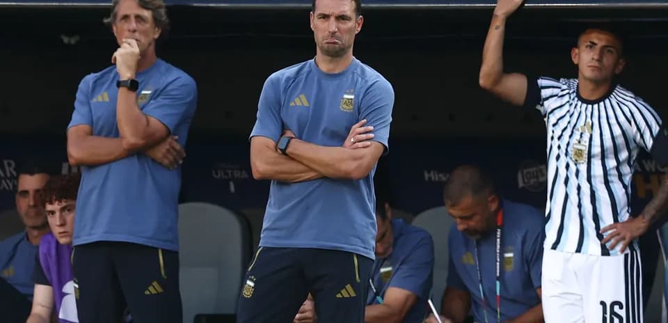 Coaches and staff observing match from bench