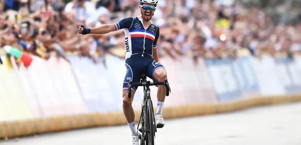 Cyclist celebrating victory at finish line
