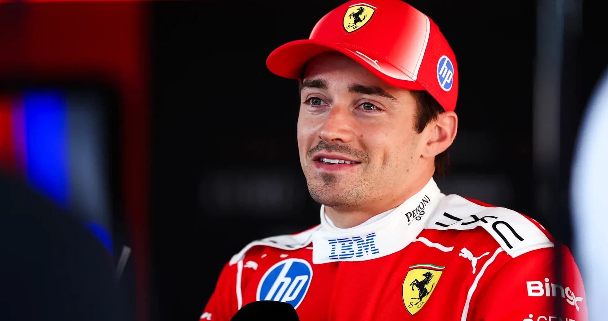 Formula 1 driver speaking in Ferrari team uniform