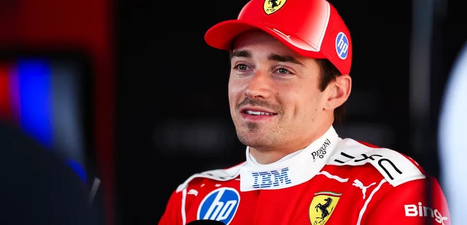 Formula 1 driver speaking in Ferrari team uniform