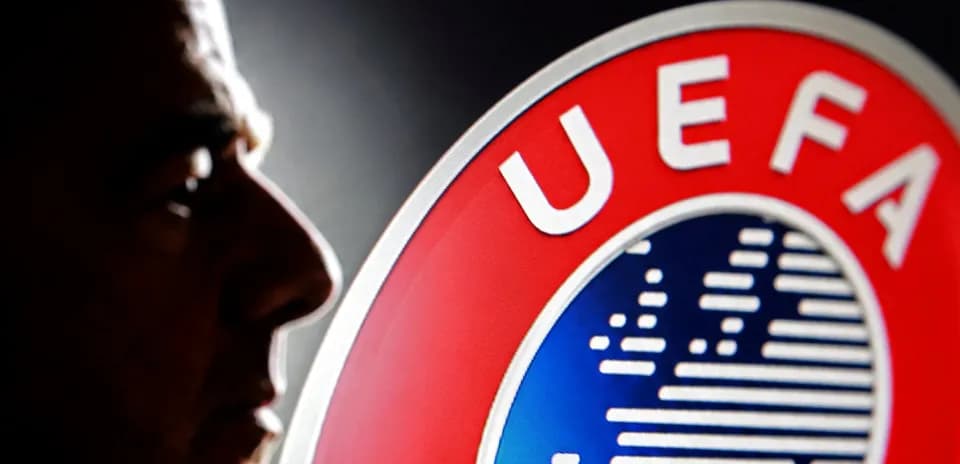 Shadows of a man next to UEFA logo