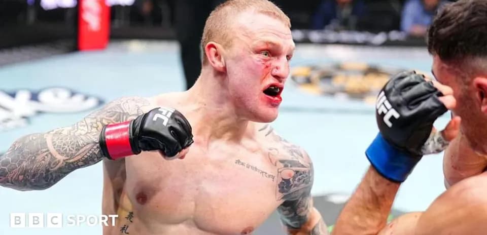 Fighter delivering a punch during UFC match