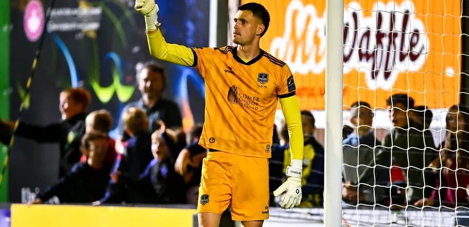 Goalkeeper signaling during a match at stadium