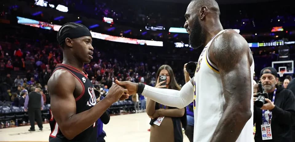 Two basketball players shaking hands after the game