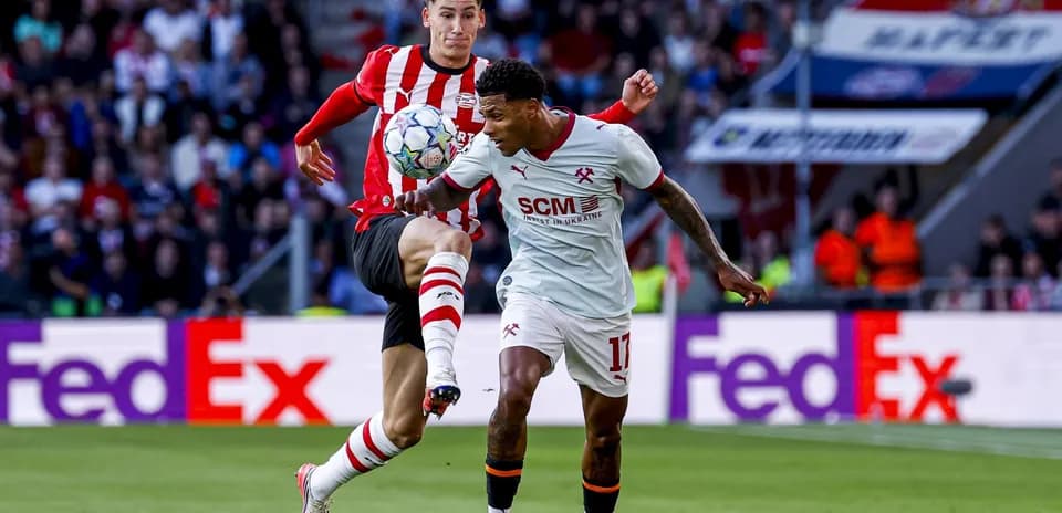 Two players competing for the ball during match