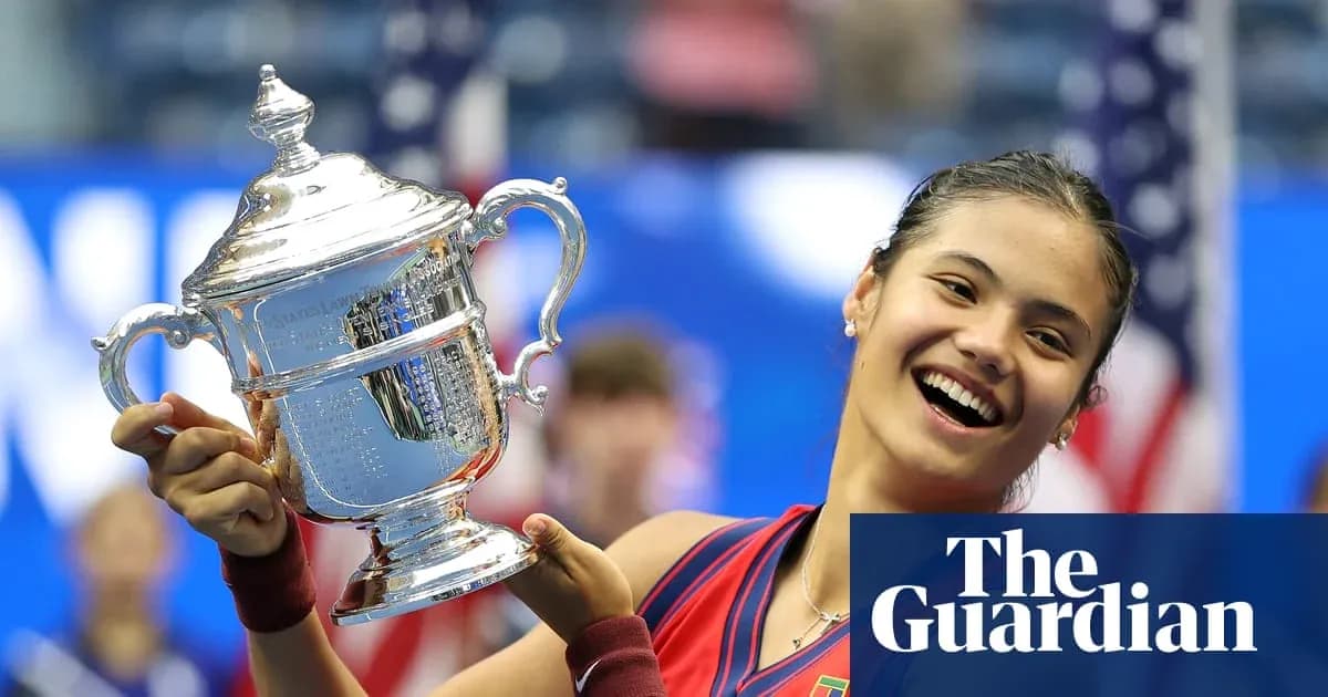 Tennis player holding US Open trophy on court