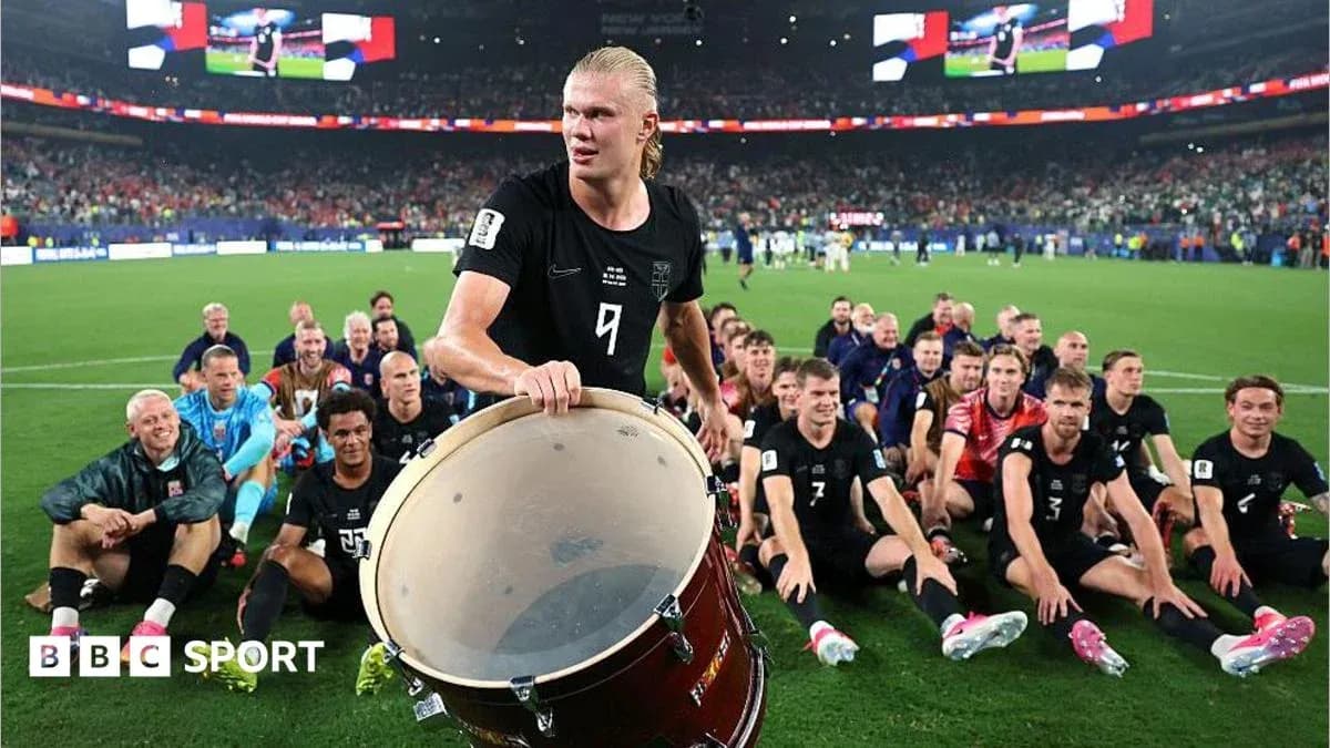 Haaland playing drum with teammates celebrating victory