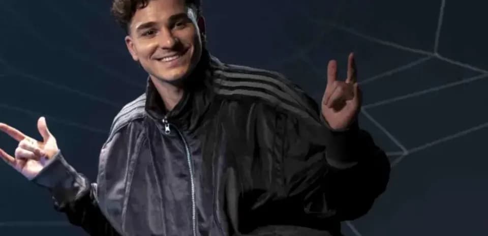 Young man in black jacket making hand gestures