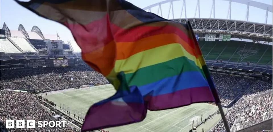 Rainbow flag waving at sports stadium during event