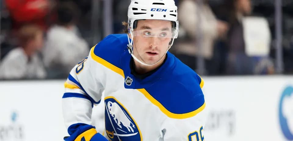 Hockey player wearing Buffalo Sabres jersey on ice